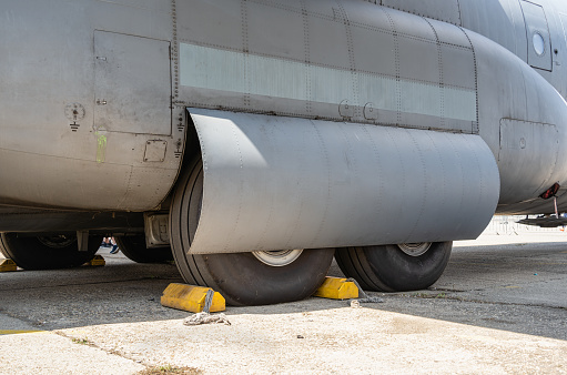 Close up detail with a landing gear of a large cargo airplane. Aircraft tires wheels