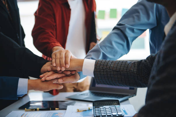 istock business people shaking hands during a meeting in modern office 1814473522