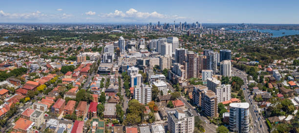 Panoramic aerial drone view of Bondi Junction in the Eastern Suburbs of Sydney, NSW with Sydney City in the background on a sunny day Panoramic aerial drone view of Bondi Junction in the Eastern Suburbs of Sydney, NSW Australia with Sydney City in the background on a sunny day bondi junction stock pictures, royalty-free photos & images
