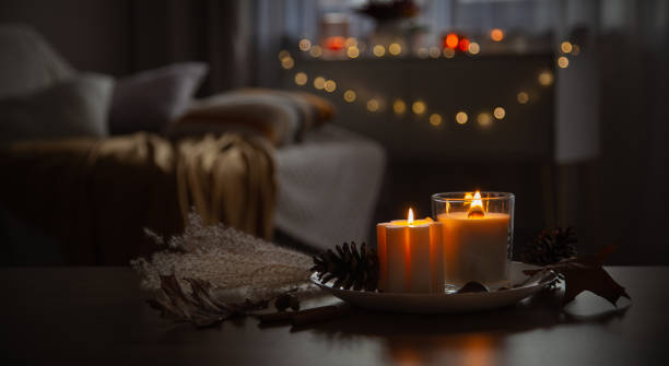 istock autumn and winter home decor with burning candles 1814480673