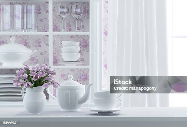 Composition Of White Kitchenware And Vase Of Purple Flowers Stock Photo - Download Image Now