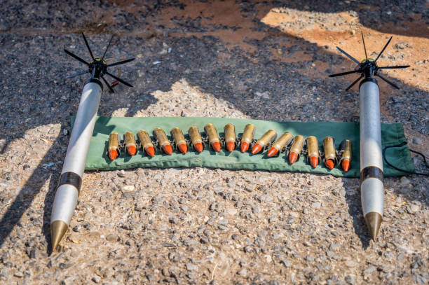 istock Rockets and bullets ammunition on the ground. 1814506424
