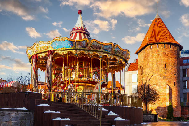 istock Shiny children's carousel with toy horses 1814571610