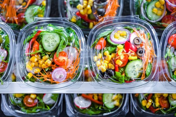 istock Boxes with pre-packaged vegetable salads in a commercial fridge 1814585077