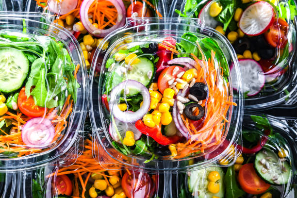 istock Boxes with pre-packaged vegetable salads in a commercial fridge 1814586032
