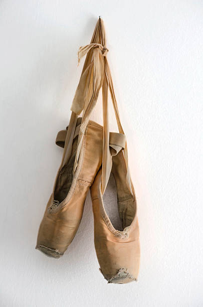 Ballet Shoes Hanging On Wooden Barre In Studio High-Res Stock Photo - Getty  Images