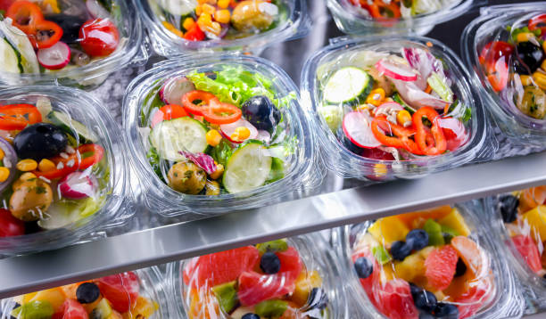 istock Boxes with pre-packaged vegetable salads in a commercial fridge 1814606914