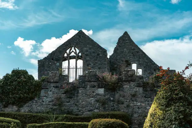 Photo of Irish church ruins with blue cloudy sky