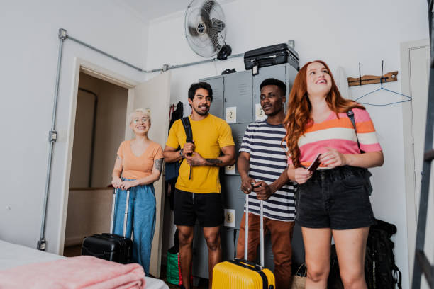 istock Friends talking and entering in bedroom at hostel 1814656317