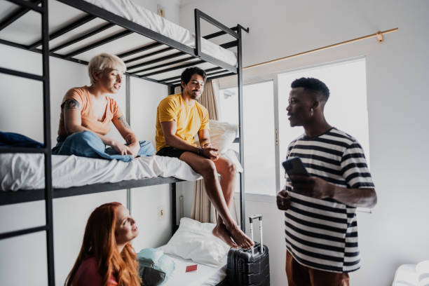 istock Roommates talking in bedroom at hostel 1814658521
