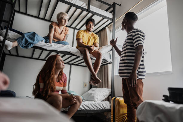 istock Roommates talking in bedroom at hostel 1814659076