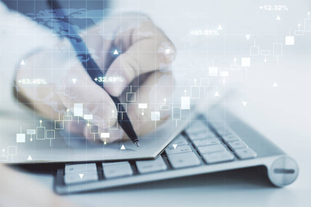 istock Multi exposure of abstract financial graph with world map and with hand writing in diary on background with laptop, financial and trading concept 1814737178