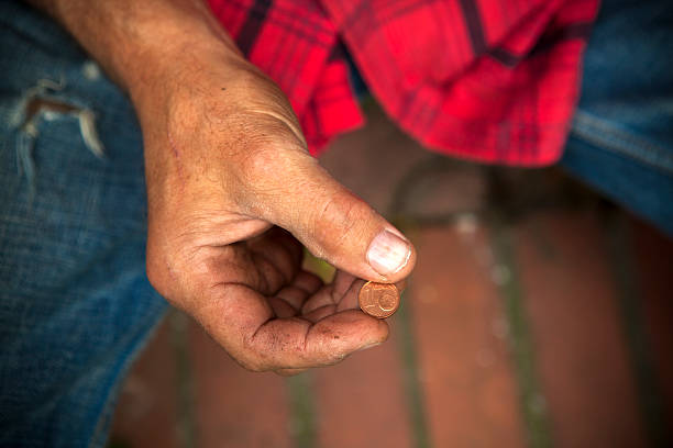 istock One eurocent in dirty fingers 181473814