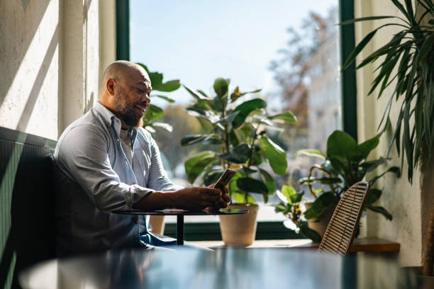 istock Adult man using smartphone indoor 1814752149
