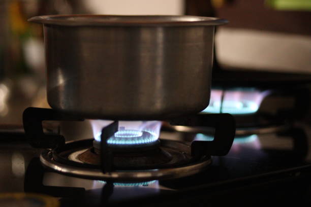 istock Kitchen Utensils on the blue LPG flame stove in blurred background 1814767165