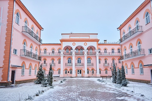 Jurmala,  Latvia - March 3, 2024: The building of the legendary resort hotel (also known as the former Kemeri sanatorium) rises above the park parterre like a white ship.