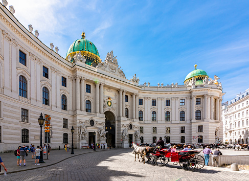 Vienna, Austria - April 2019: Hofburg palace on St. Michael square (Michaelerplatz)
