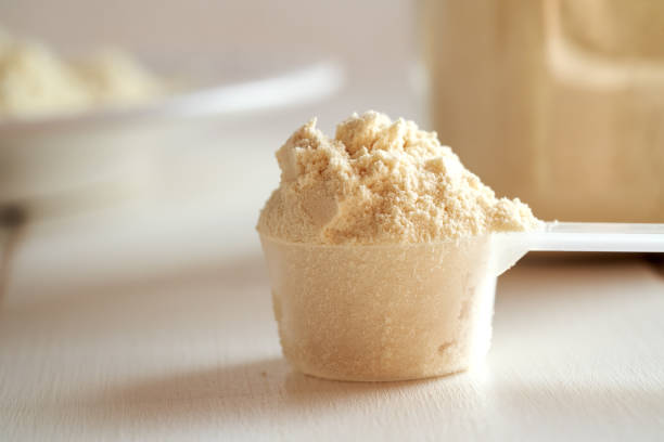 istock Whey protein powder in a measuring cup 1814787850