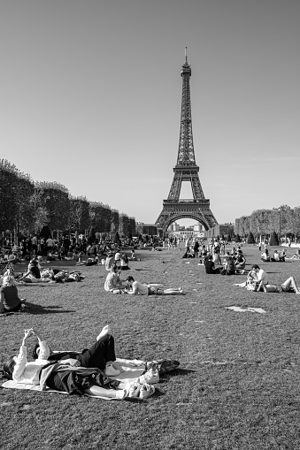 Paris, France - October 8, 2023 : Panoramic view of the Champ de Mars, Field of Mars, a large public greenspace where people enjoying the beautiful view of the Eiffel Tower of Paris France