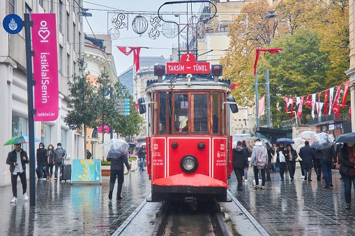 Istanbul, Turkey - November 23, 2021: Istiklal Street. The famous old red tram.