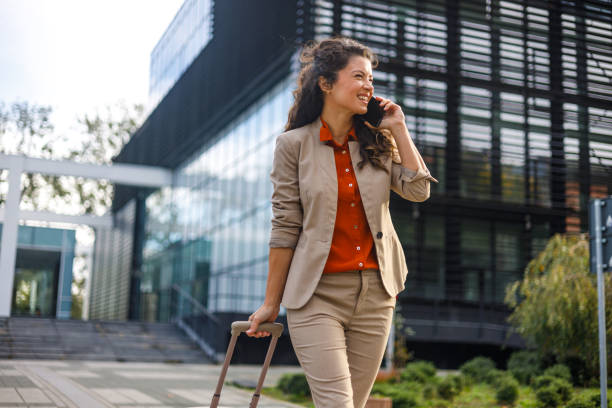 istock Multitasking with luggage and phone 1814814506