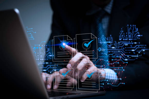 istock Businessman writes signing contract, designs, draws, or sketches projects through a tablet on the office desk. Hand concept stamp of approval on a public notarization certificate document electronic. 1814814770