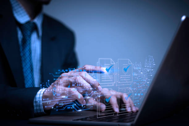 istock Businessman writes signing contract, designs, draws, or sketches projects through a tablet on the office desk. Hand concept stamp of approval on a public notarization certificate document electronic. 1814814776