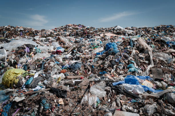 a large pile of city garbage at the landfill. waste dump. recycling concept - toxic substance spilling pouring bottle imagens e fotografias de stock