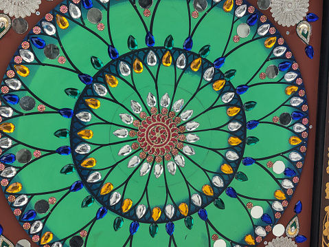 Closeup of Indian traditional floral pattern design on ceiling of a an architecture