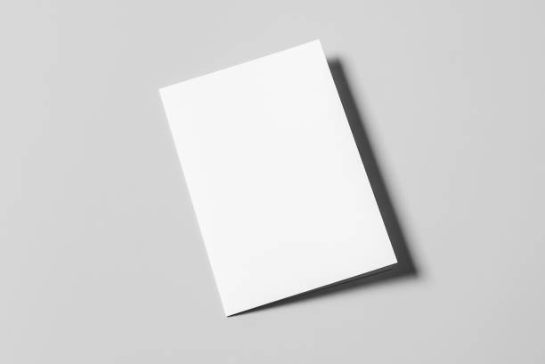 istock A4 Bi-Fold Brochure Mockup on Grey Background. 3D Rendering in Hand 1814817997