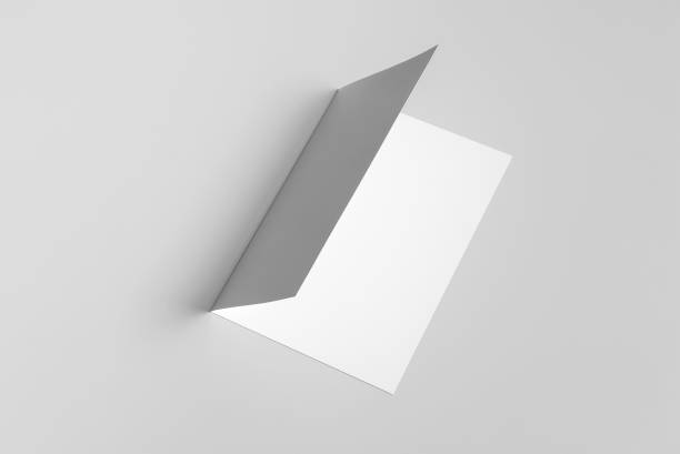 istock A4 Bi-Fold Brochure Mockup on Grey Background. 3D Rendering in Hand 1814818751