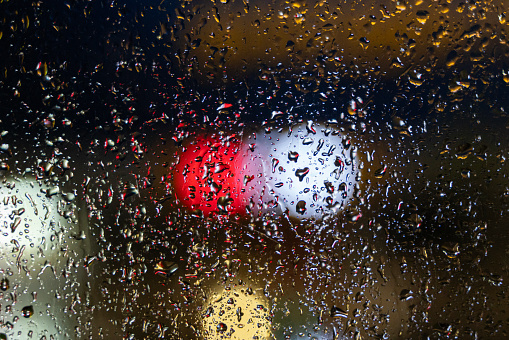 Window and rain drop in condominium or apartment room on a rainy day