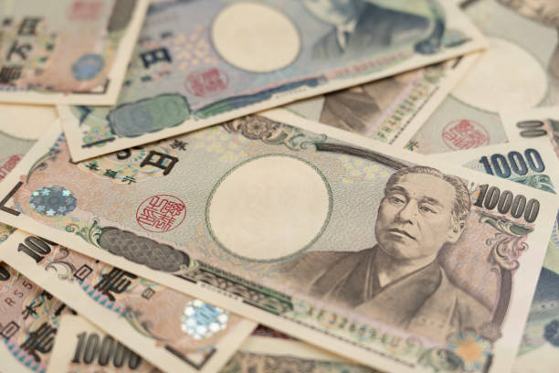 close up money japanese notes. a bundle of bills. background on the theme of banks, finance and the economy of japan - japanse valuta stockfoto's en -beelden