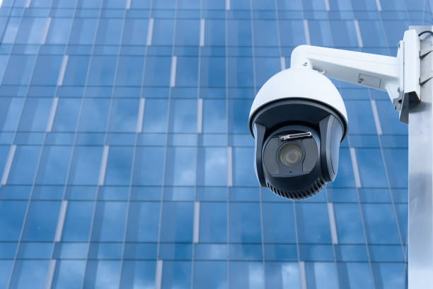 istock CCTV camera front of office building. Close-up. 1814837910