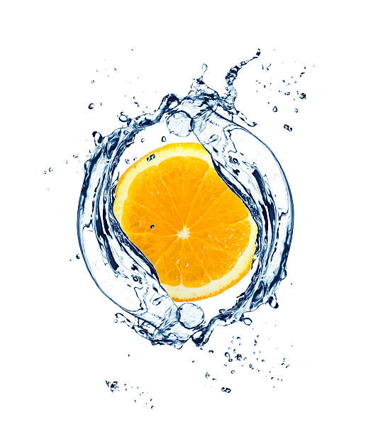 istock orange in spray of water 181484383