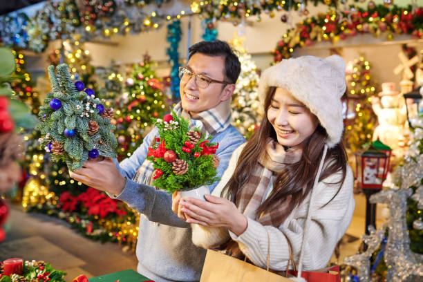istock Asia Couple Buying Christmas Present 1814848773