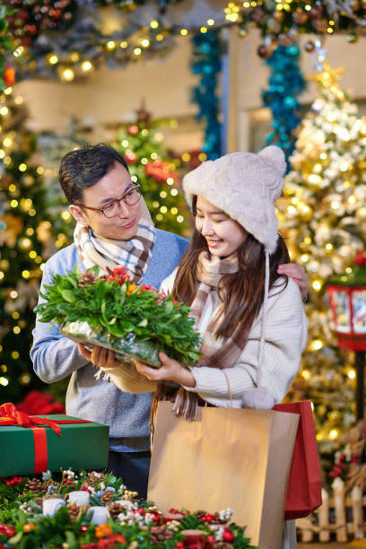 istock Asia Couple Buying Christmas Present 1814849822
