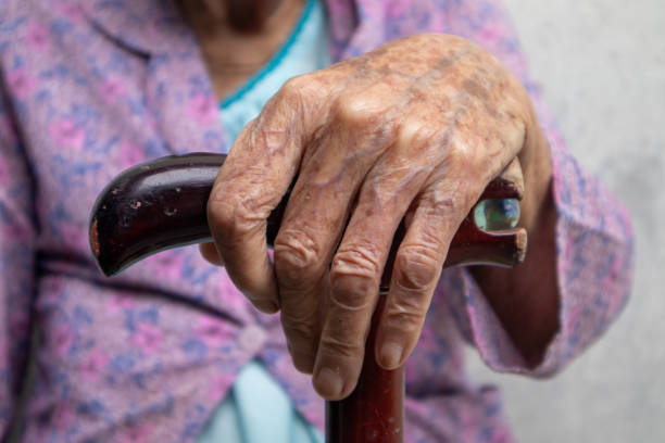 istock Elderly people's hands while holding a cane, even while sitting or walking, health problems in old age 1814859742