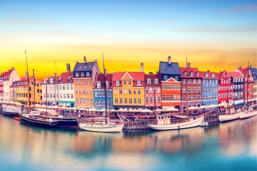 magical fascinating landscape with boats in a famous Nyhavn in the capital of Denmark Copenhagen. Exotic amazing places. Popular tourist atraction.