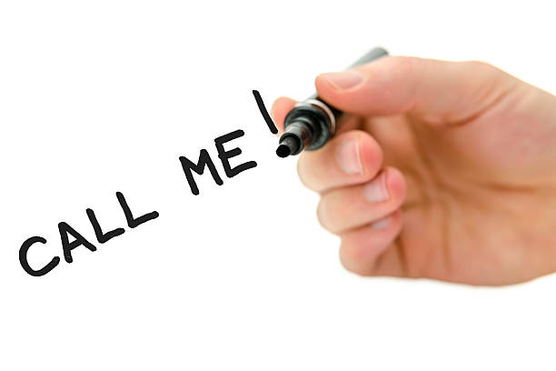 istock Male hand writing Call me message on a virtual whiteboard 181486490