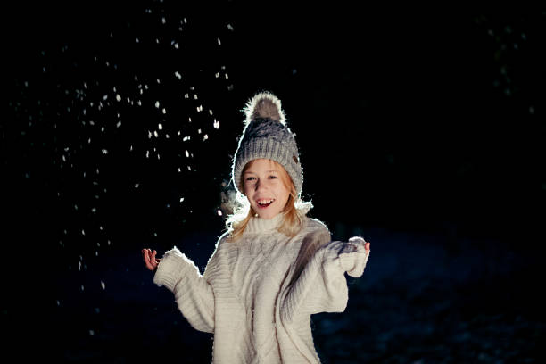girl playing with snow