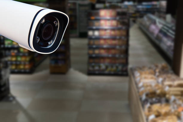 istock CCTV camera system security in shopping mall supermarket blur background.,Abstract background with Blurred people and shopping center. 1814886256