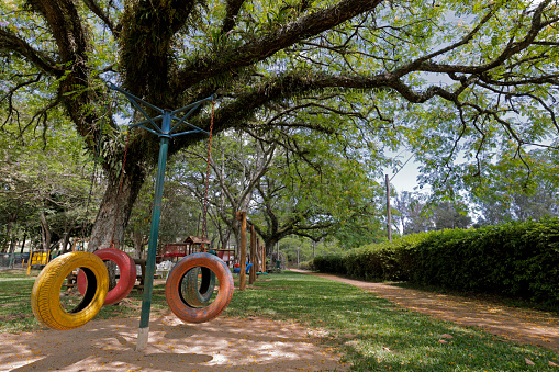 park with playgrounds and swings made from car tires
