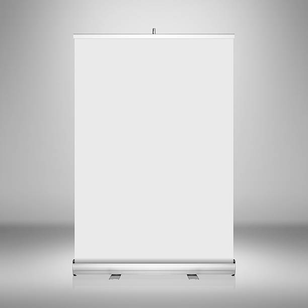 Clear empty studio background with blank roll up banner display. Clear empty photographer studio background with blank roll up banner display.Clear empty studio background with blank roll up banner display. roll up banner photos stock pictures, royalty-free photos & images