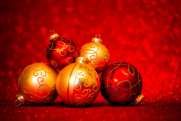istock Golden and red Christmas Baubles on glitter background 1814901045