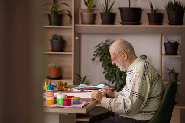 istock Male artist paints on a canvas in his studio 1814901322
