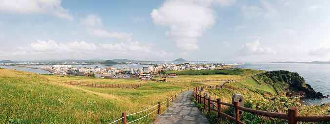 Panoramic view of Seongsan Ilchulbong Tuff Cone seaside walkway in Jeju Island, Korea