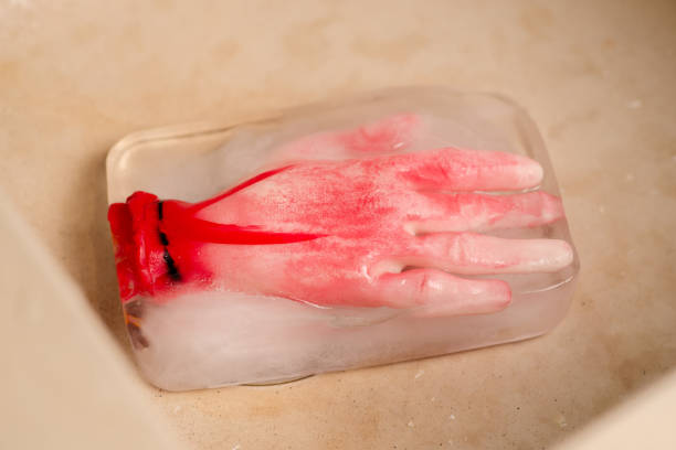 istock Ice-cold horror: A conceptual horror image with an artificial human hand frozen within an ice block, creating an eerie and suspenseful atmosphere 1814904563