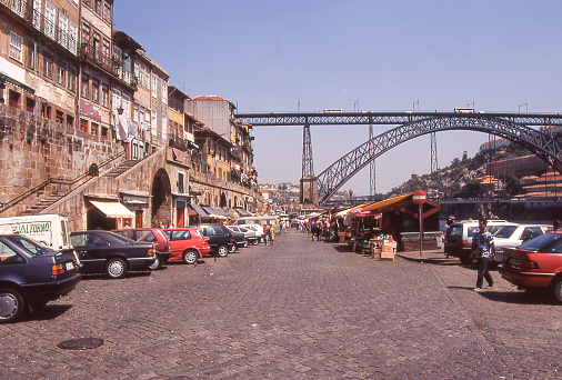 Porto, Portugal - aug 5, 1993: view of the Douro riverfront and the Dom Luis iron bridge in the Ribeira district of Porto