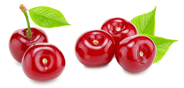 red cherry with green leaves isolated on white background. clipping path